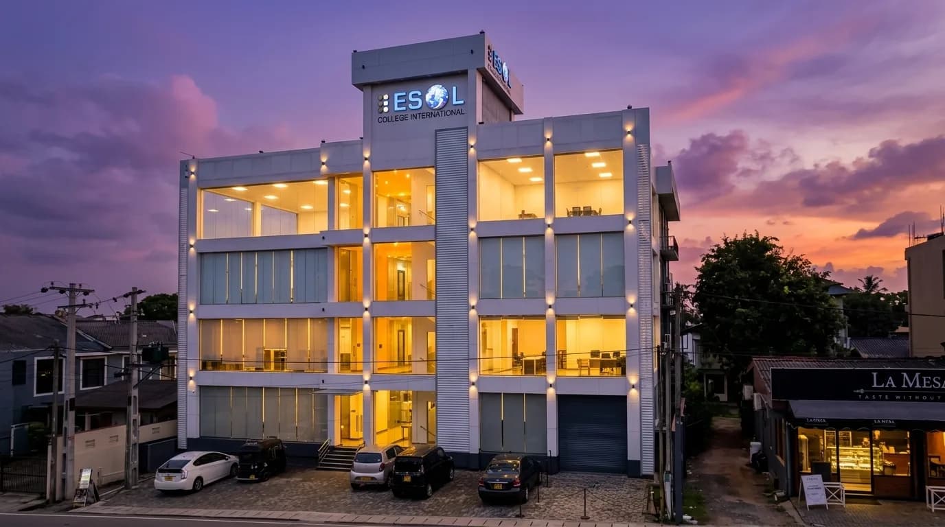 ESOL College International main campus building exterior at dusk