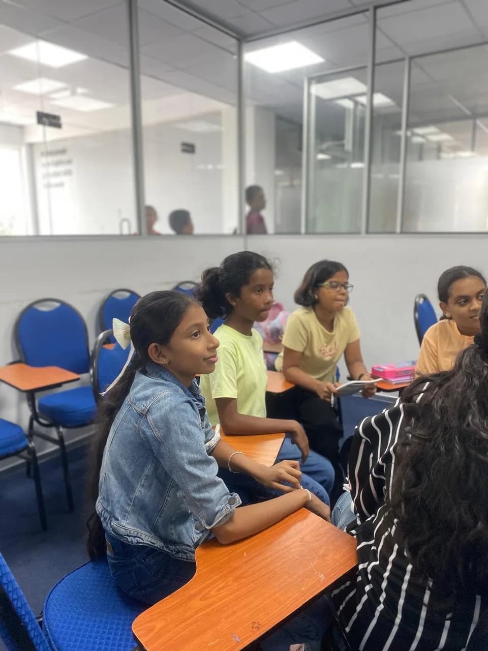 ESOL College students taking part in a small-group English Club discussion